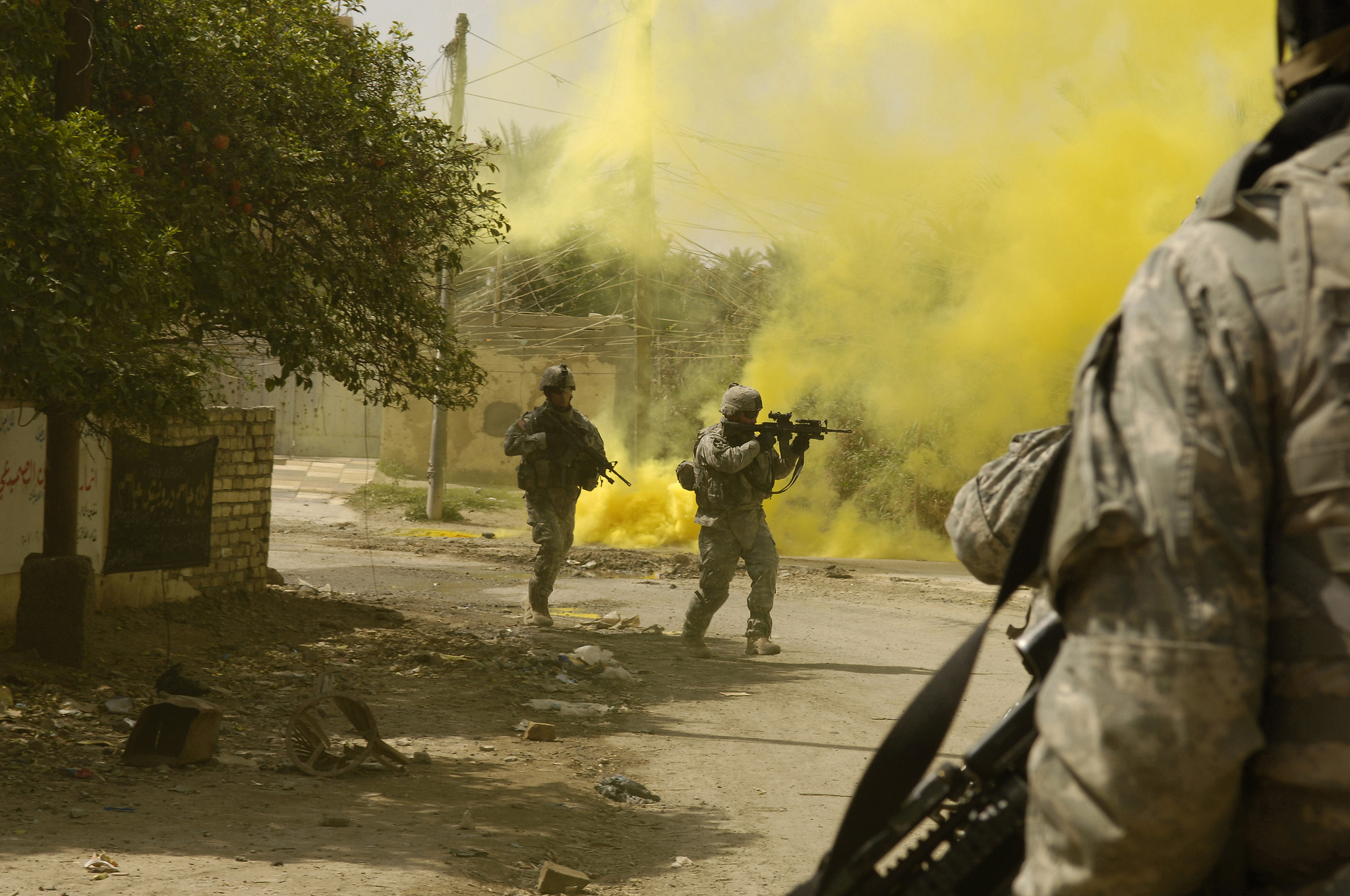 U.S. Army Soldiers from the 1st Stryker Brigade Combat Team use smoke to cover their movements while engaging anti-Iraqi forces in Buhriz, Iraq, March 14, 2007. (U.S. Air Force photo by Staff Sgt. Stacy L. Pearsall) (Released)